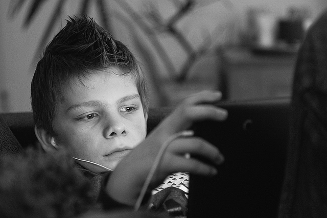 kid playing games on a laptop